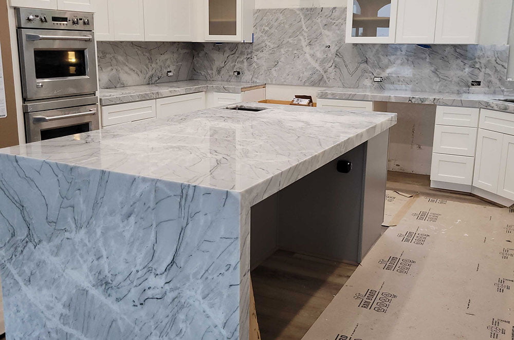 White Borealis Quartzite Kitchen with Full Backsplash and Waterfall Panel